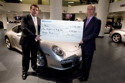 Andy Goss, Managing Director of Porsche GB, presenting check to Steve Godfrey, Project Director at Skidz