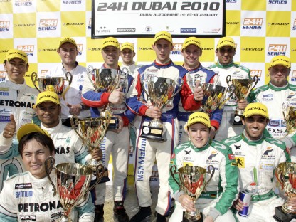 Porsche drivers on the podium at the Dubai 24 hour race