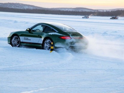 porsche 911 sliding in snow at the winter driving camp