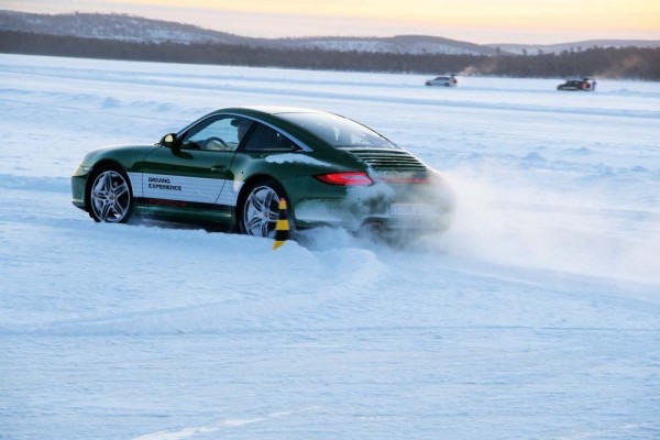 porsche 911 sliding in snow at the winter driving camp