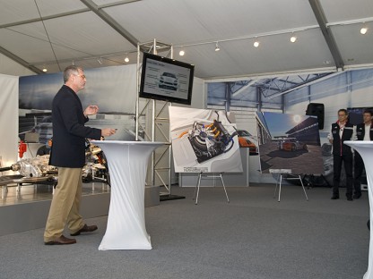 Porsche's Dr. Neusser announcing new Hybrid initiatives for Porsche