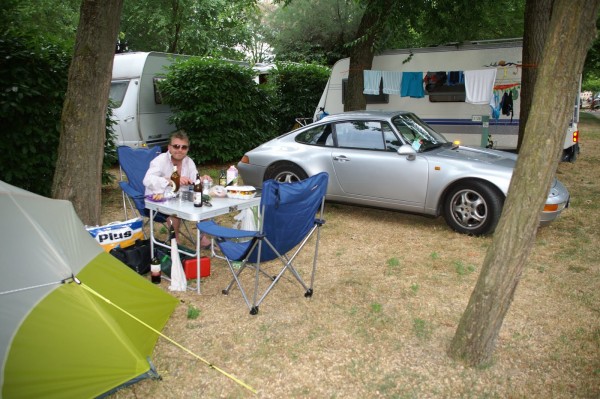 Chris Bayliss and his Porsche 993 at a campsite