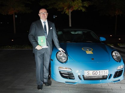 Bernhard Meier, posing with Porsche 911 Speedster Golden Classic Steering Wheel