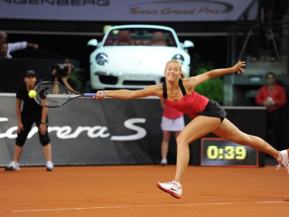 Maria Sharapova reaching for a shot at 2012 Porsche Tennis Grand Prix