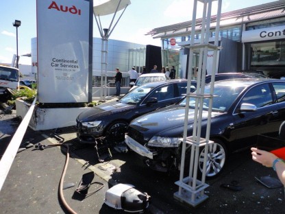 aftermath of truck crashing into Porsche dealer in New Zealand