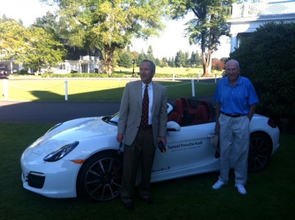Peter Jones and his father Sheldon in front of the Porsche he won for hitting a hole-in-one