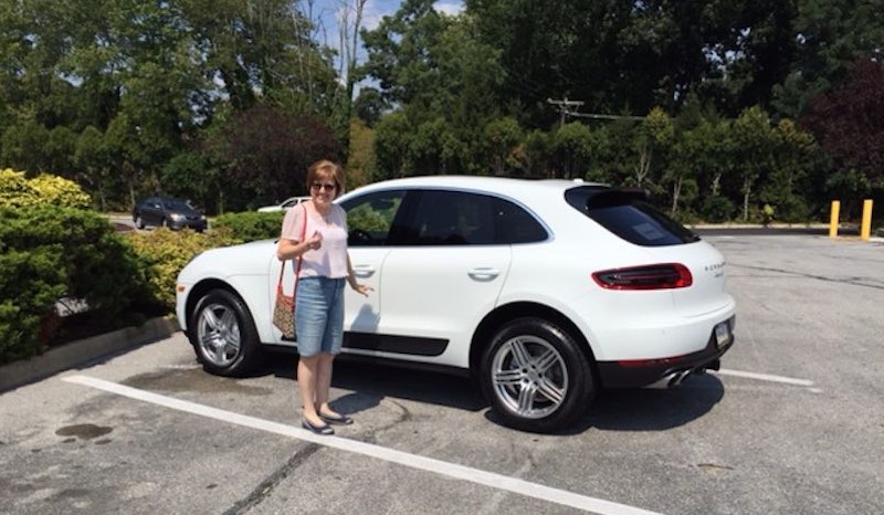 Christine taking delivery of her new Macan