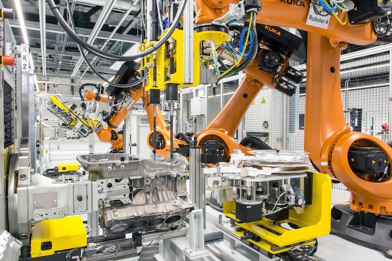 robots assembling engine porsche v-8 factory