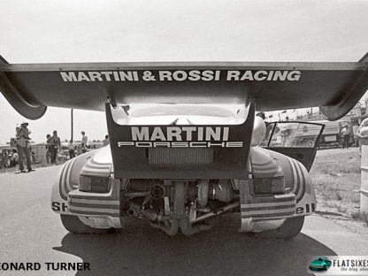 rear view of a Porsche Turbo Carrera RSR showing it's massive whale tale during a race at Watkins Glen 1974